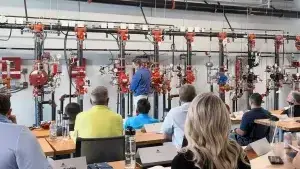 Instructor in front of risers teaching class